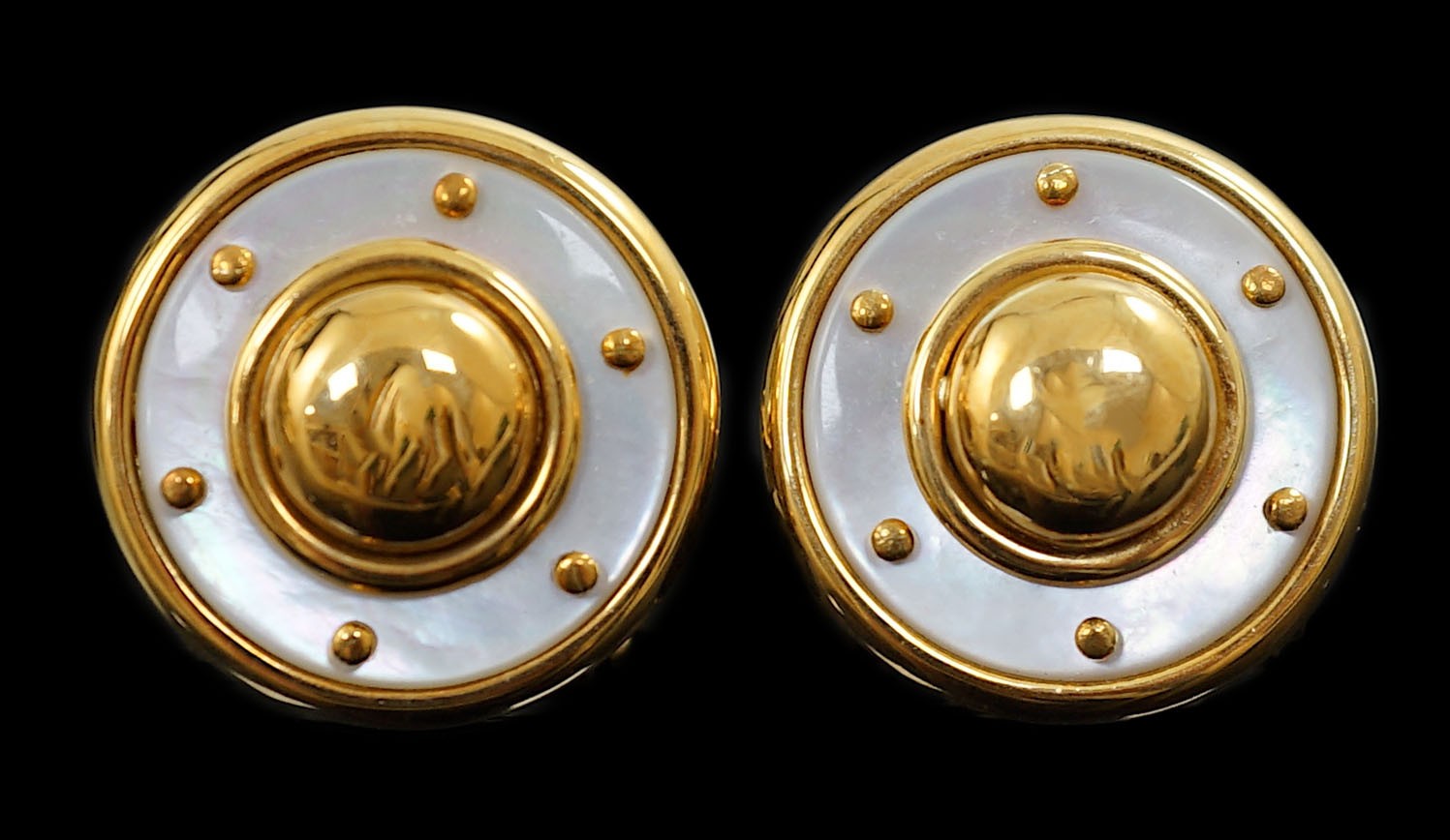 A modern pair of 18ct gold and mother of pearl set disc shape earrings, in Boodle & Dunthorne box